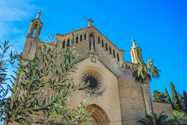 Low angle view of building against clear blue sky