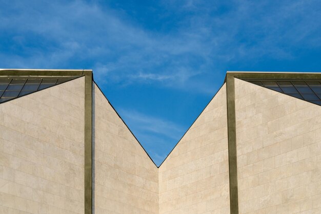 Low angle view of building against cloudy sky