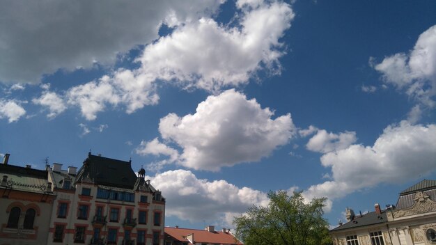 Low angle view of building against cloudy sky