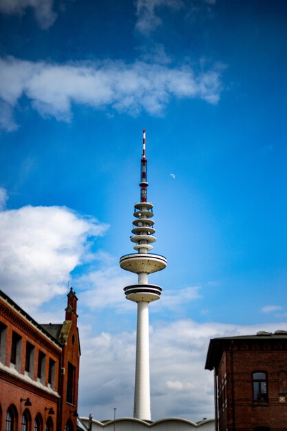 Low angle view of building against cloudy sky