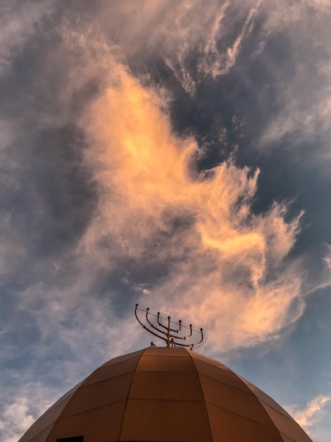 low angle view of building against sky during sunset