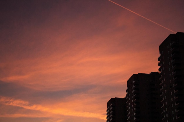 low angle view of building against sky at sunset