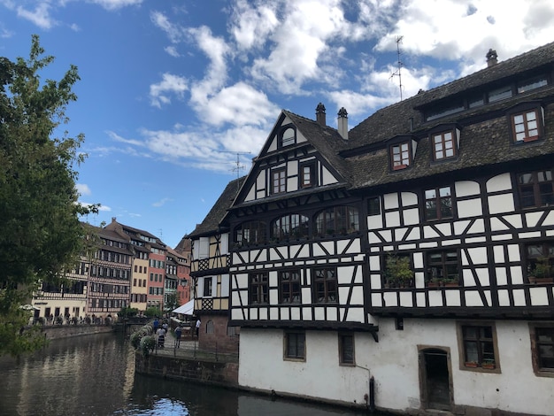 low angle view of building by river against sky