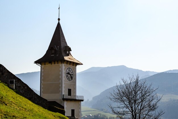 Low angle view of building and mountains against sky