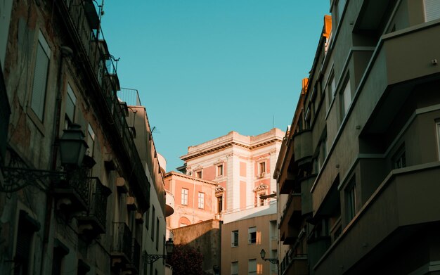 Low angle view of buildings against blue sky