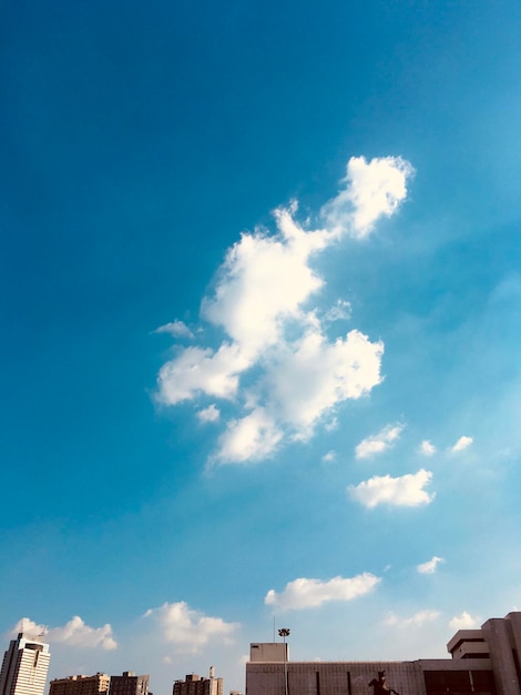 Low angle view of buildings against blue sky