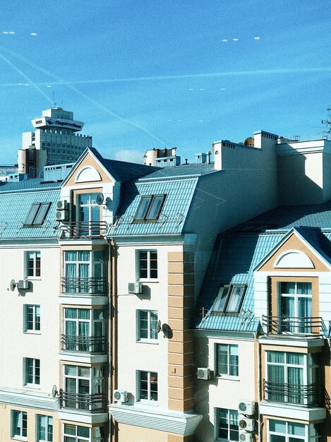 Low angle view of buildings against blue sky