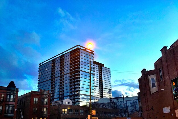 Low angle view of buildings against blue sky