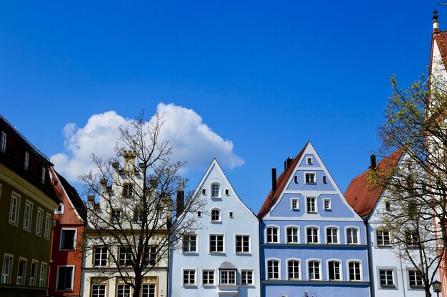 Low angle view of buildings against blue sky