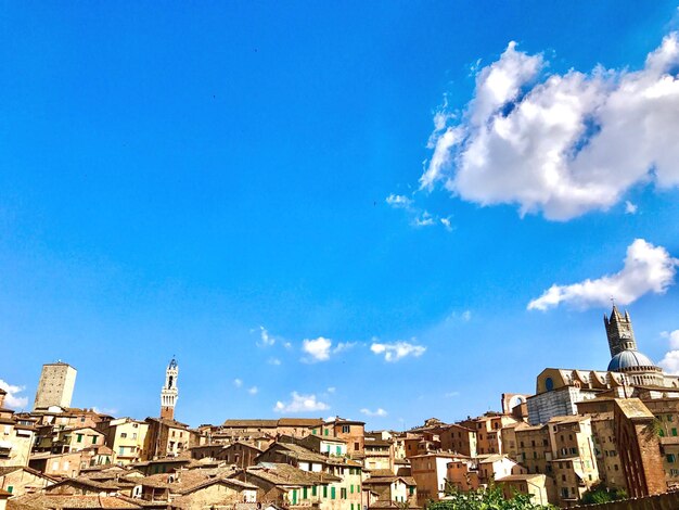 Low angle view of buildings against blue sky