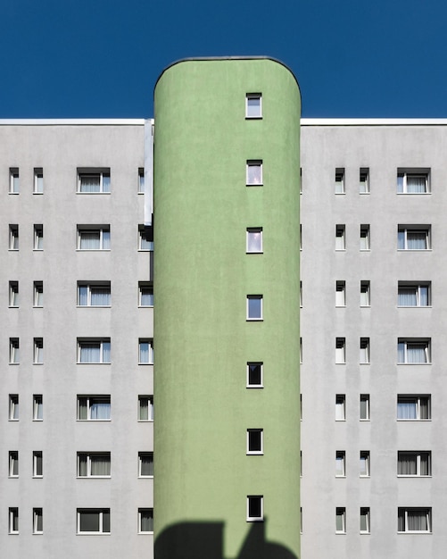 Low angle view of buildings against clear blue sky