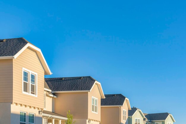 Low angle view of buildings against clear blue sky