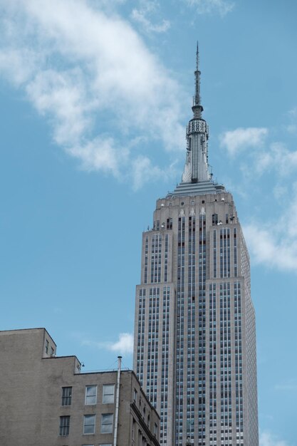 Low angle view of buildings against cloudy sky