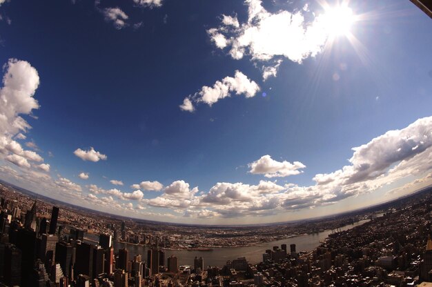 Low angle view of buildings against cloudy sky