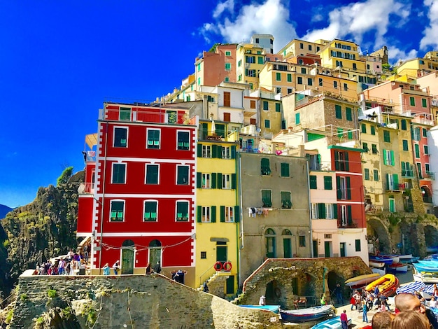 Low angle view of buildings riomaggiore against sky