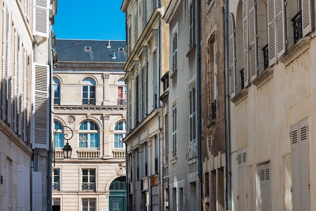 Low angle view of buildings in town against sky