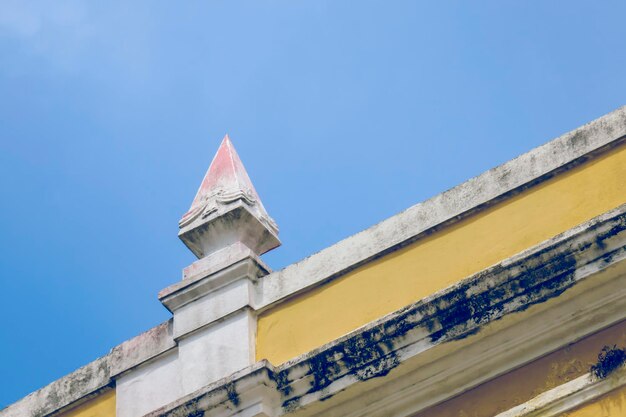 Low angle view of built structure against clear blue sky