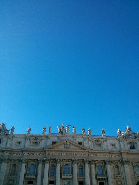 Low angle view of built structure against clear blue sky