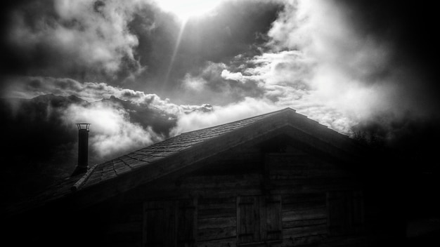 Low angle view of built structure against cloudy sky