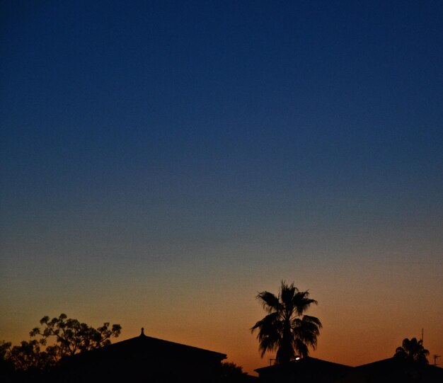 Low angle view of built structure at sunset