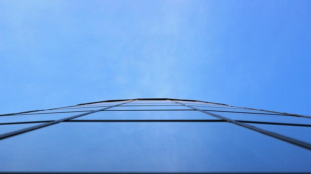 Low angle view of cables against clear blue sky