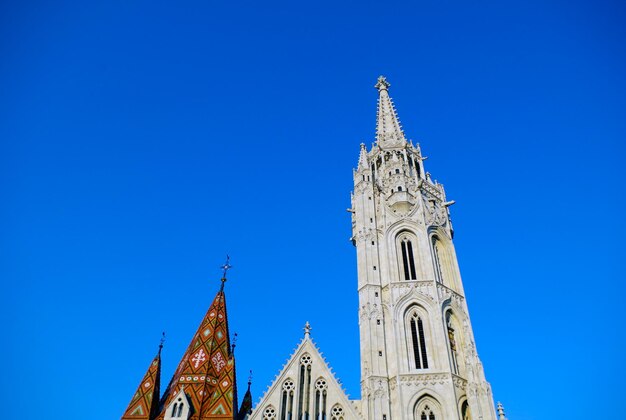 Low angle view of cathedral against clear blue sky