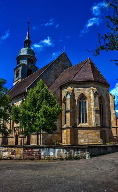 Low angle view of church against blue sky