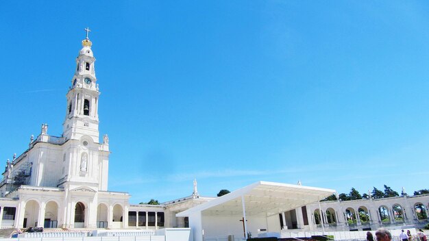 Low angle view of church against clear blue sky