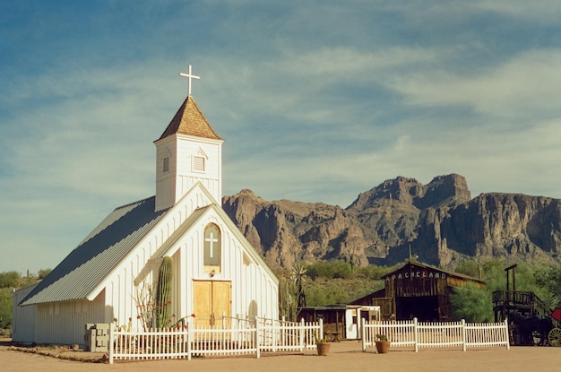 Low angle view of church against mountain background