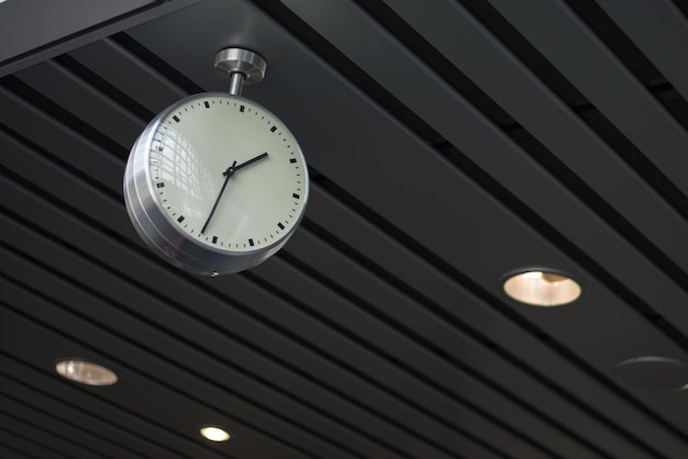 low angle view of clock hanging on ceiling