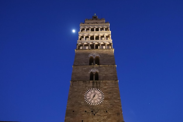 Low angle view of clock tower against blue sky