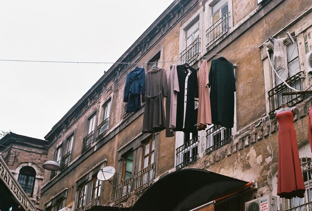 Low angle view of clothes hanging outside residential building