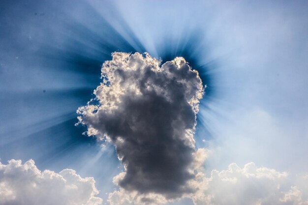 Low angle view of cloudy blue sky on sunny day