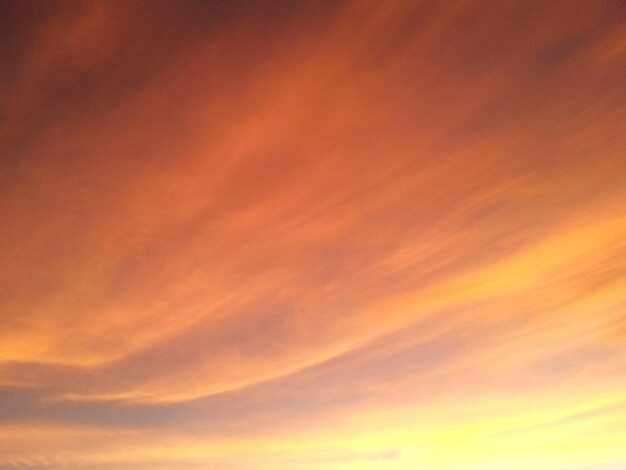 Low angle view of cloudy sky at sunset