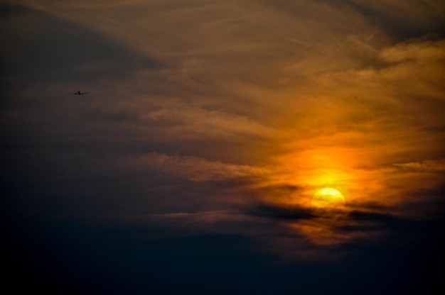 Low angle view of cloudy sky at sunset