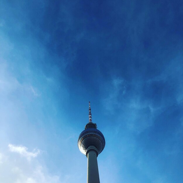 Low angle view of communications tower against sky