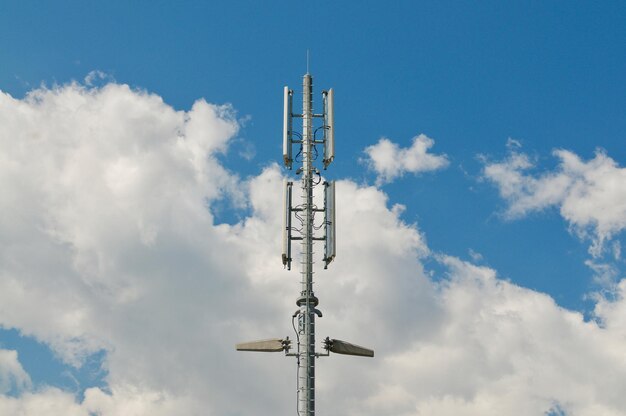 Low angle view of communications tower against sky