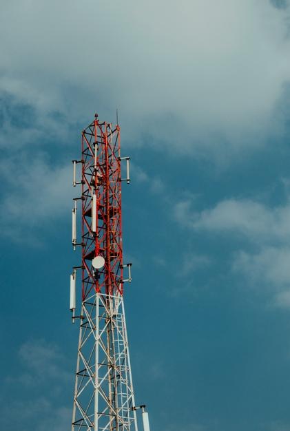 Low angle view of communications tower against sky