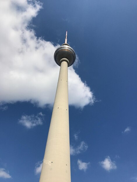 Low angle view of communications tower against sky