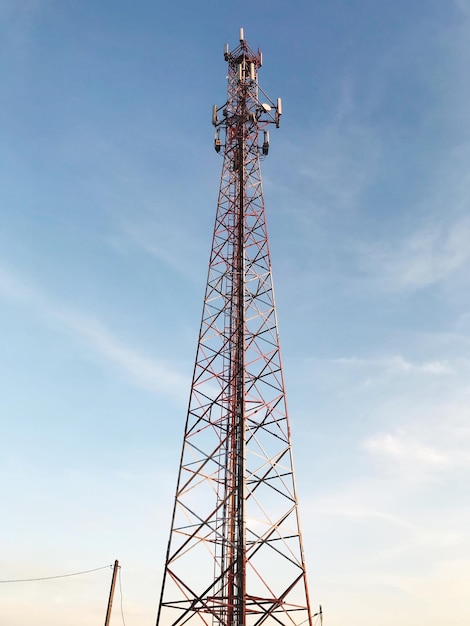 Low angle view of communications tower against sky