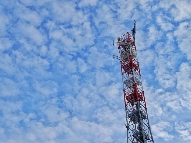 Low angle view of communications tower against sky