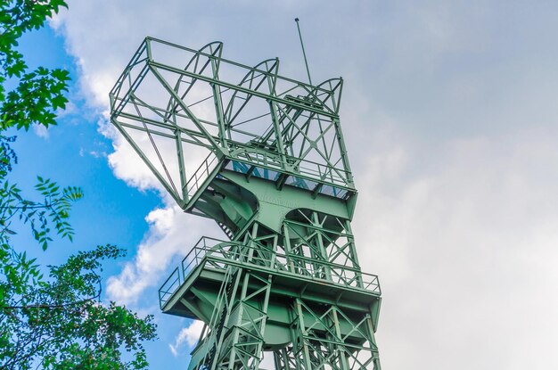 Low angle view of communications tower against sky