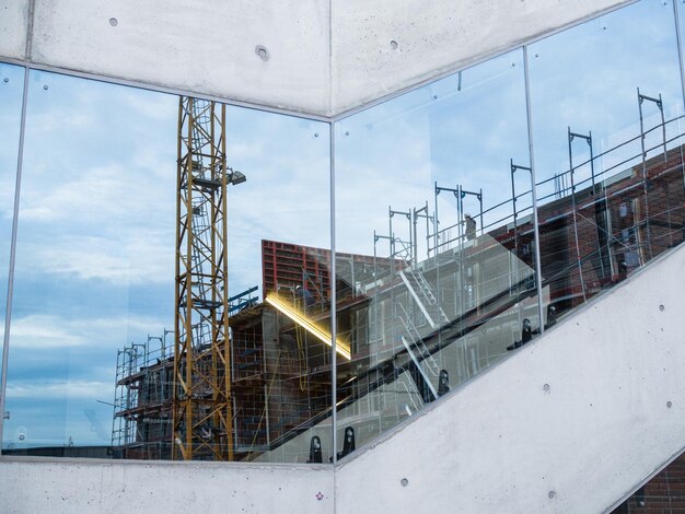 Low angle view of construction site against sky