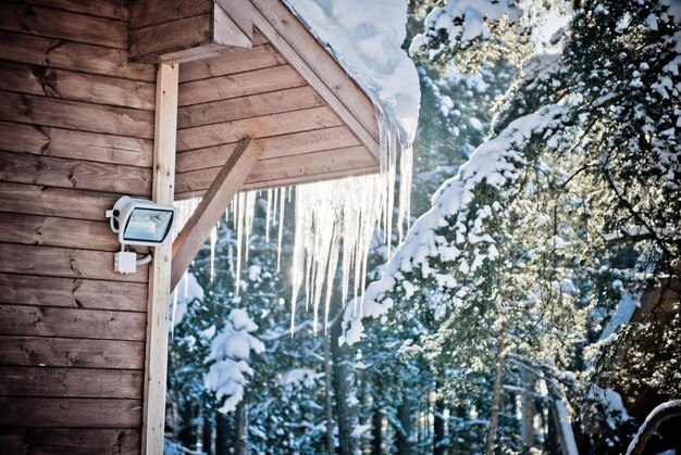 Low angle view of cottage in winter