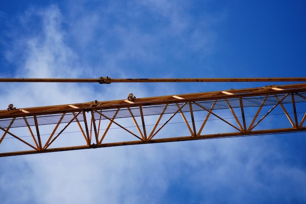 Low angle view of crane machinery part against sky