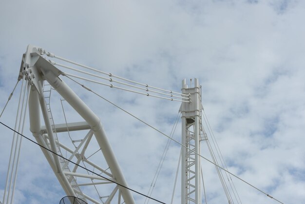 Low angle view of cranes against sky