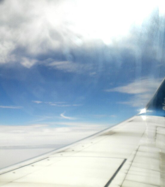 Low angle view of cropped car against sky