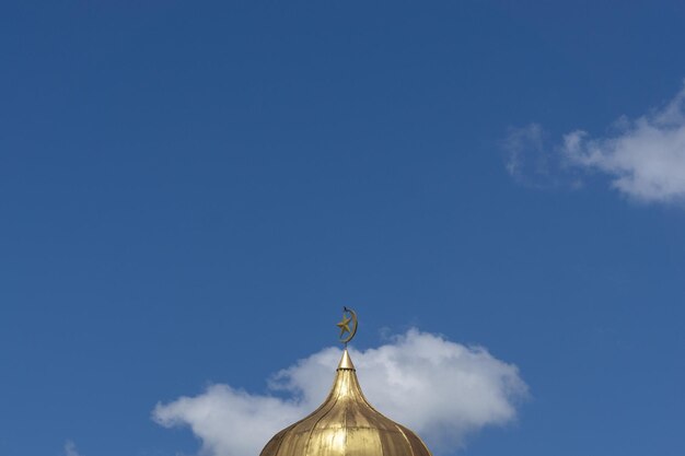 Low angle view of cross against blue sky