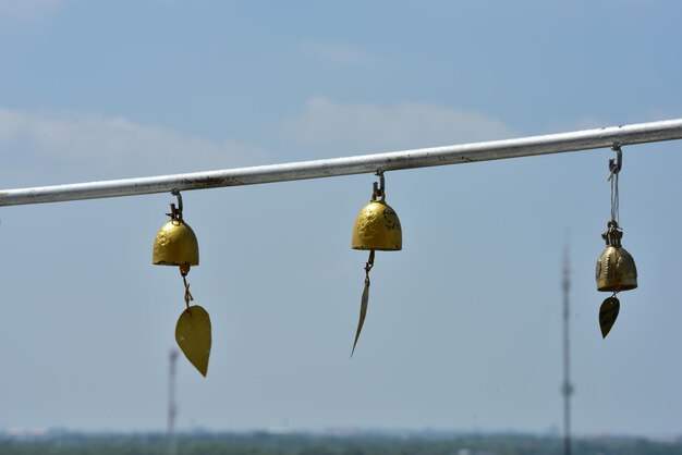 Low angle view of decorations hanging against sky