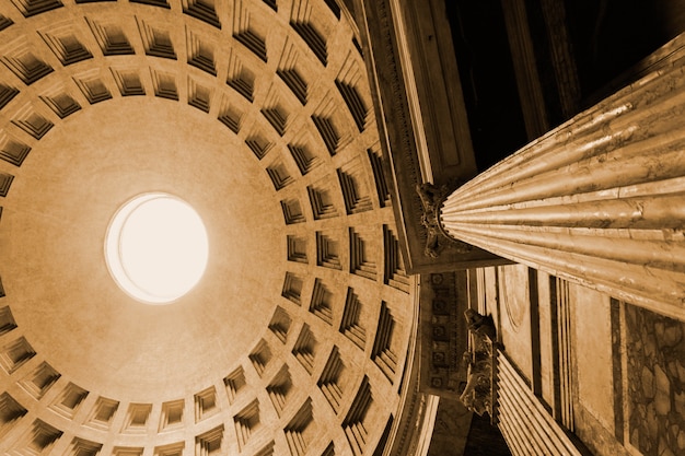 Low angle view of the dome and marble pillar of the Pantheon Rome Italy